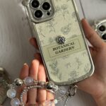 قاب موبایل آیفون باغ سلطنتی + بند ست مروارید
